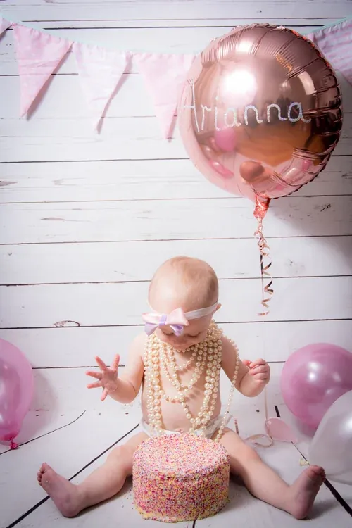 First birthday setup with balloons before the cake arrives