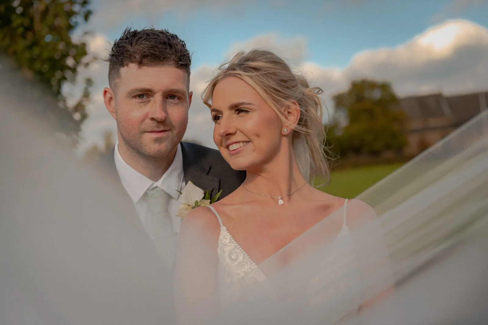 Bride and groom portrait in golden evening light at a Lancashire wedding