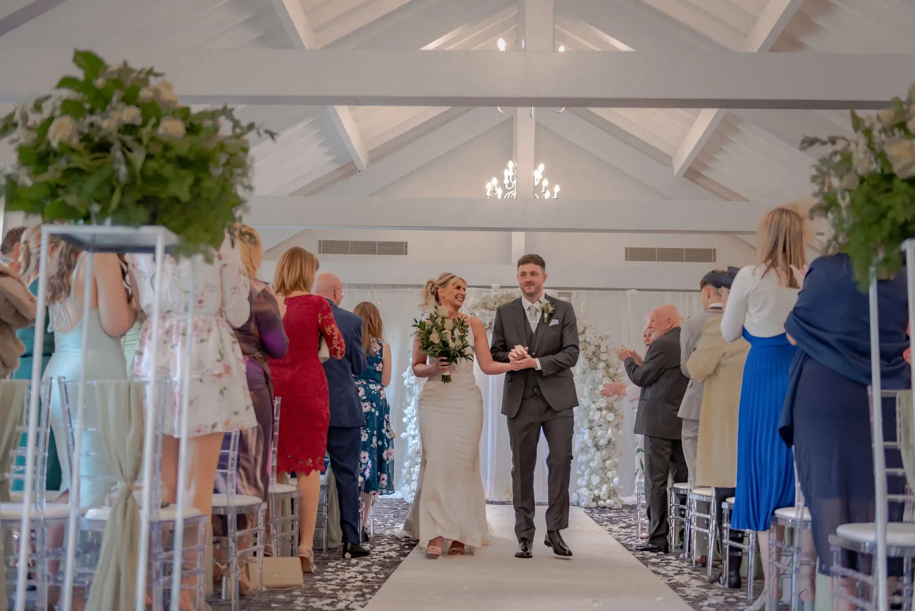 Bride and groom walk back down the aisle at a Lancashire wedding